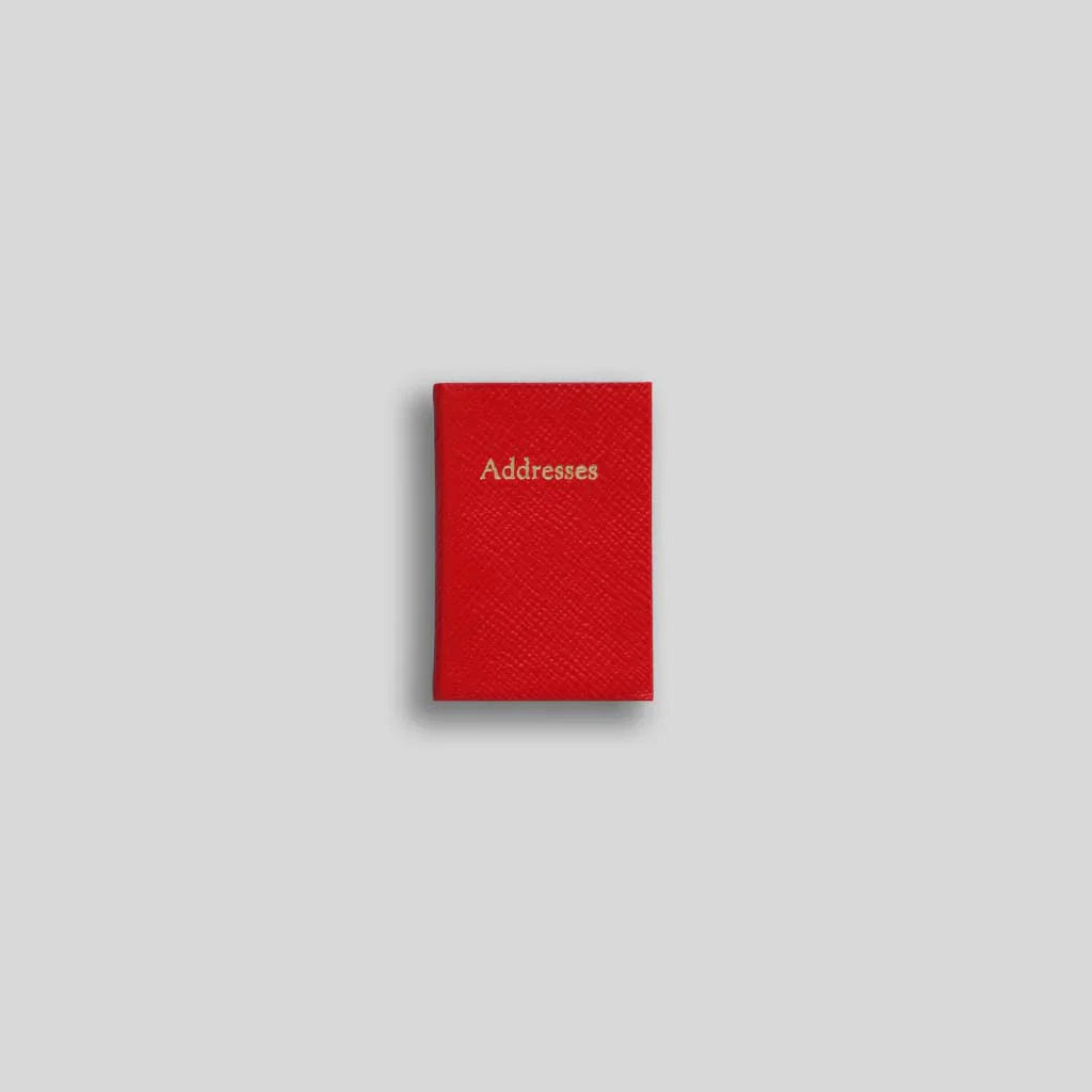 Red leather address book with gold embossed “Addresses” title