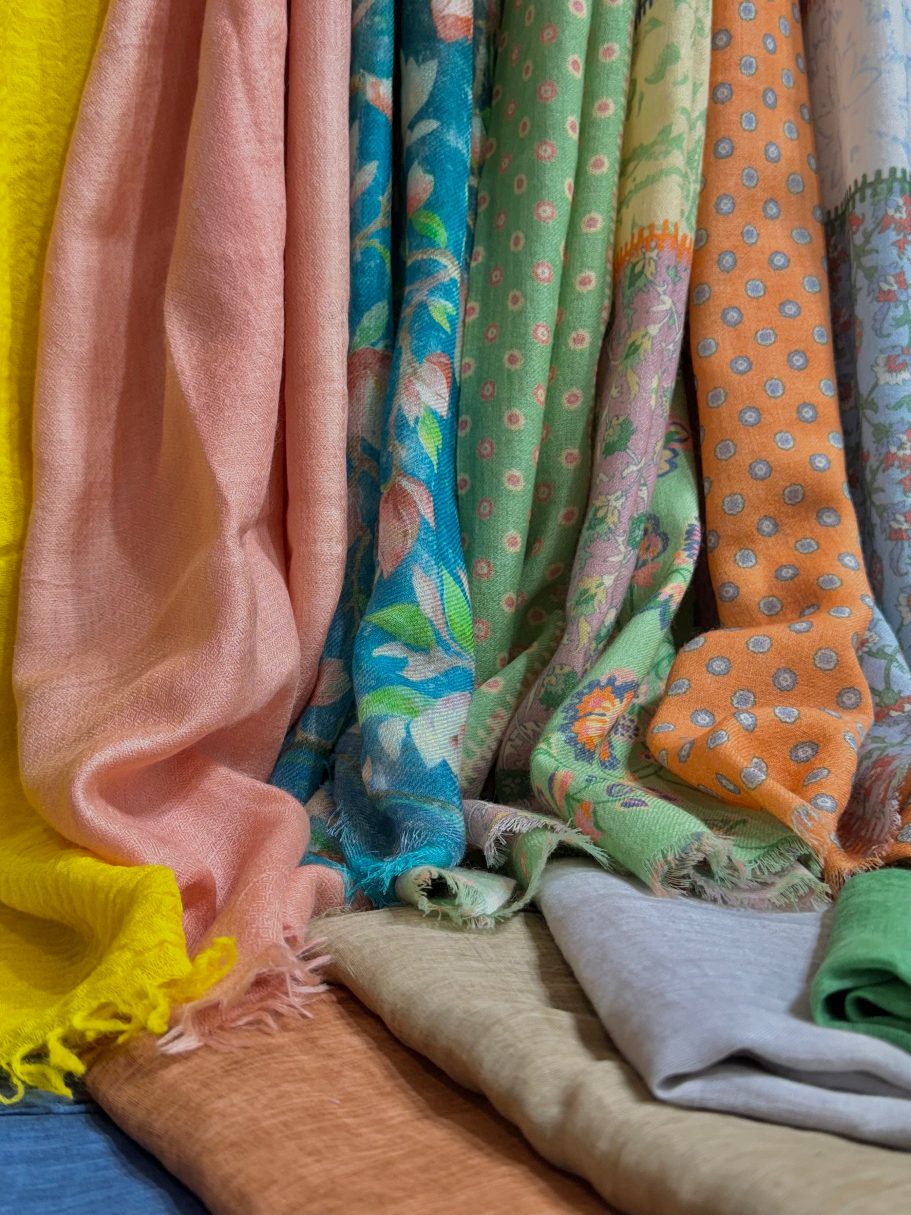 Close-Up of different colours of cotton and silk scarves 