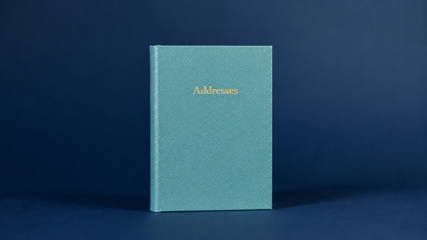 Red leather address book with gold embossed “Addresses” title