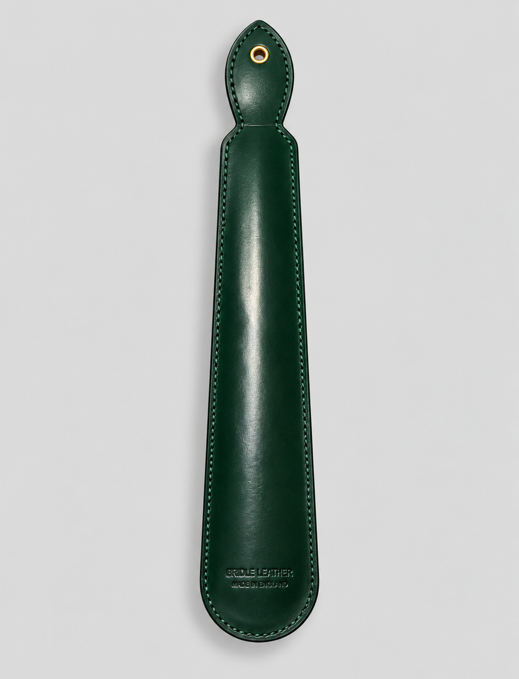 Reverse of bottle green leather shoe horn with stitched edges
