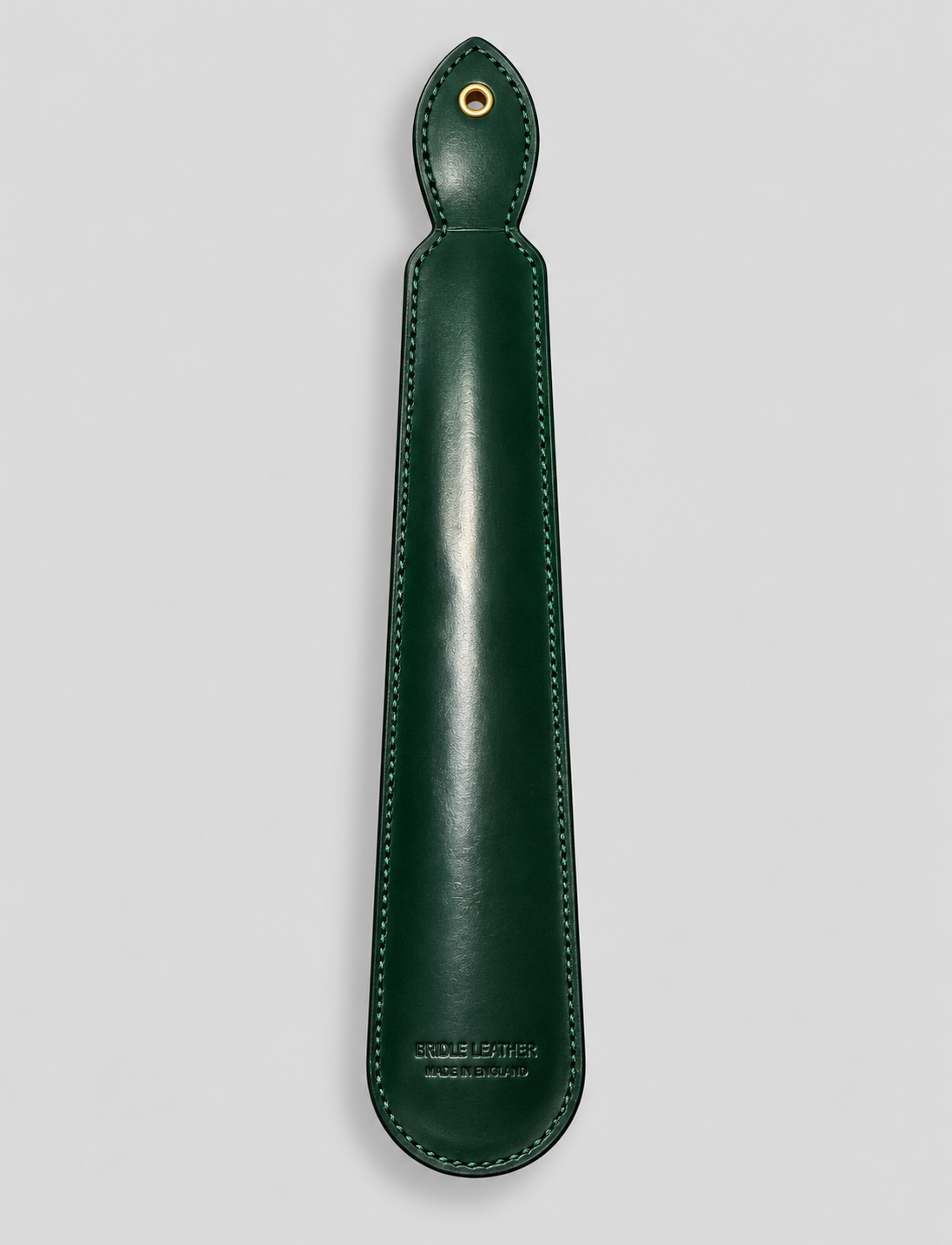 Reverse of bottle green leather shoe horn with stitched edges