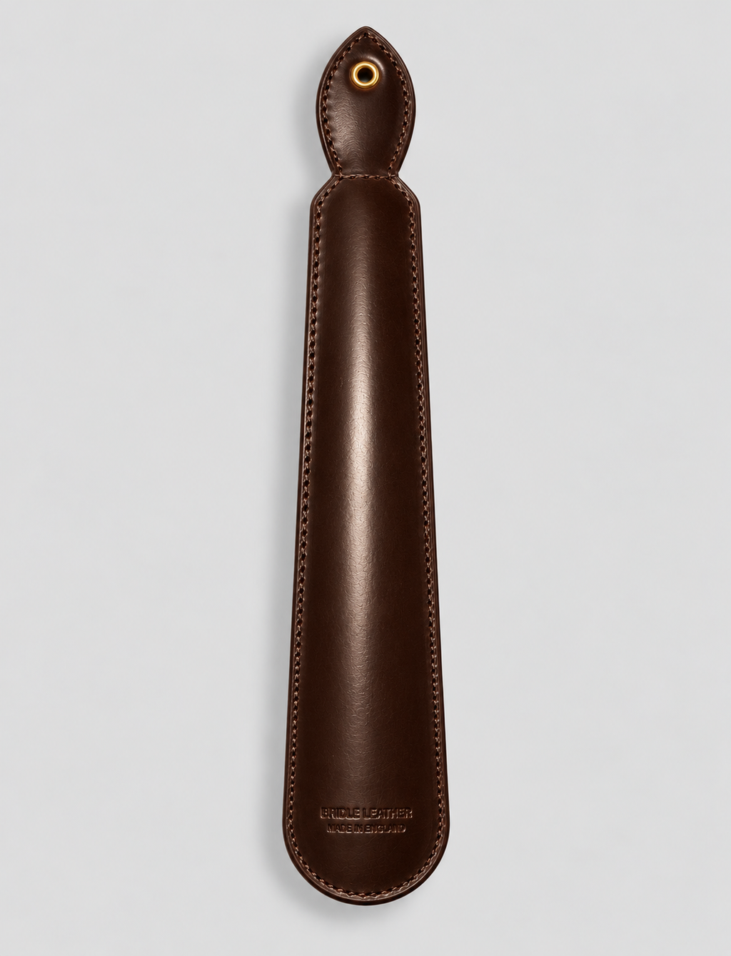 Reverse of brown leather shoe horn with stitched detailing