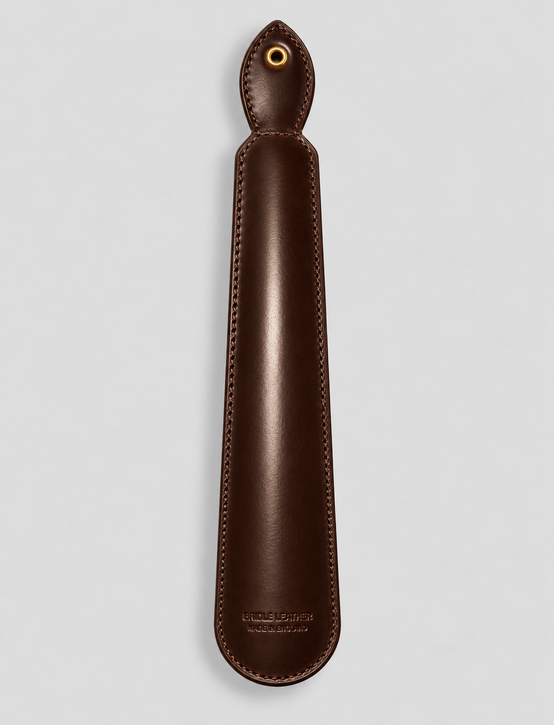 Reverse of brown leather shoe horn with stitched detailing