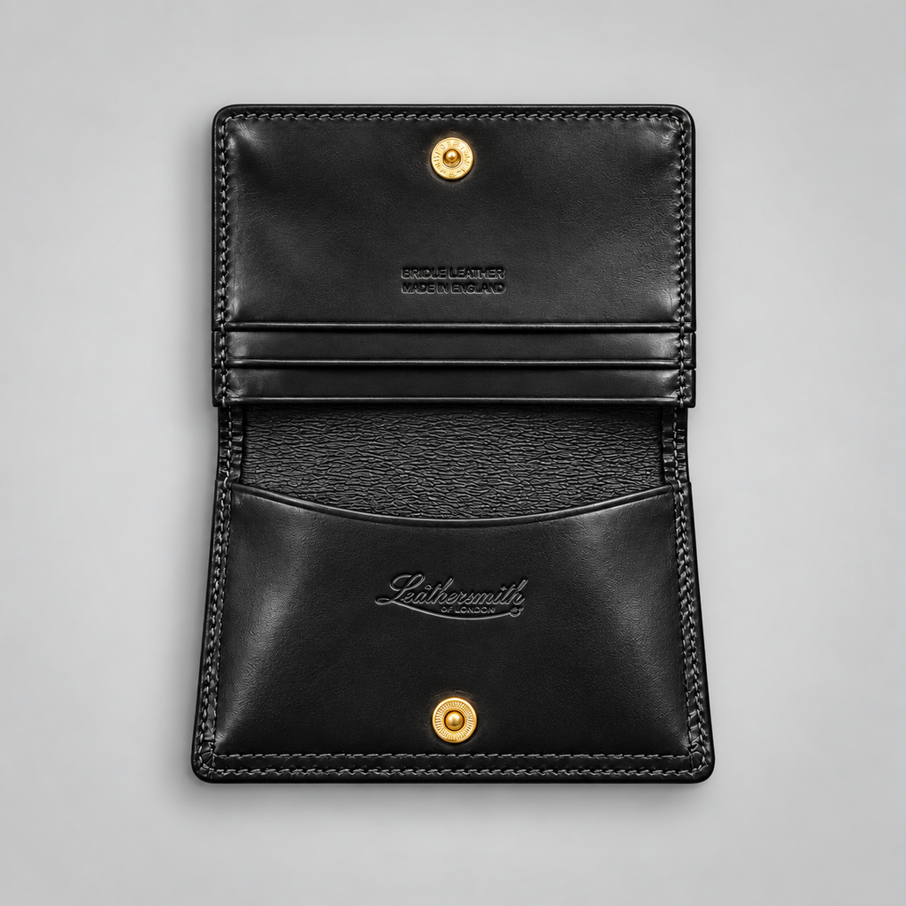Black leather business card case showing gusseted compartments
