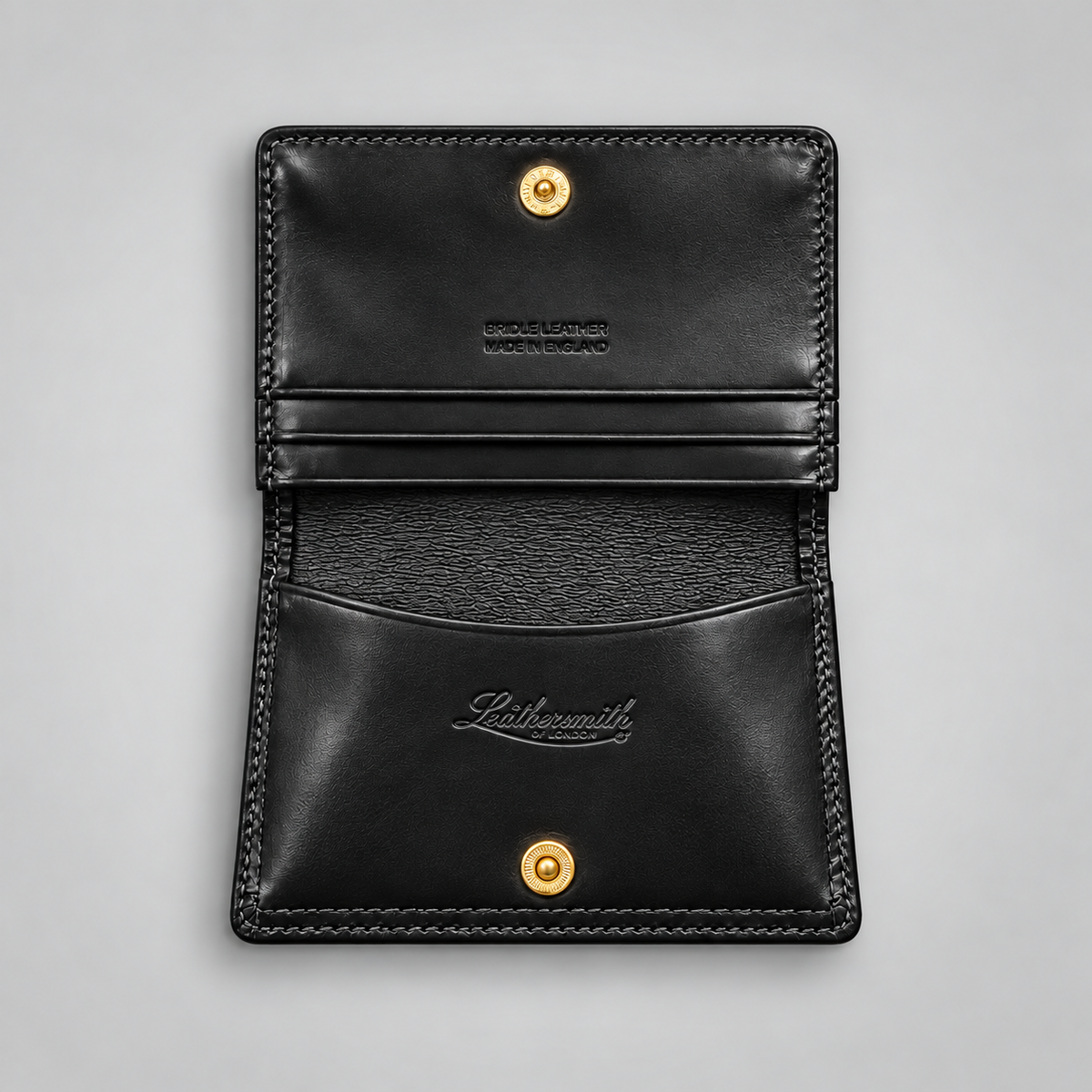 Black leather business card case showing gusseted compartments