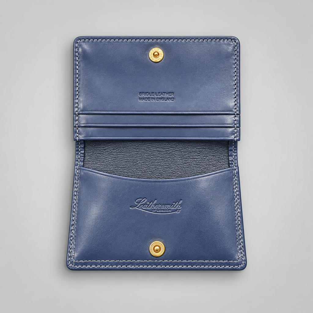 Navy leather business card case with gusseted pocket and press-stud closure