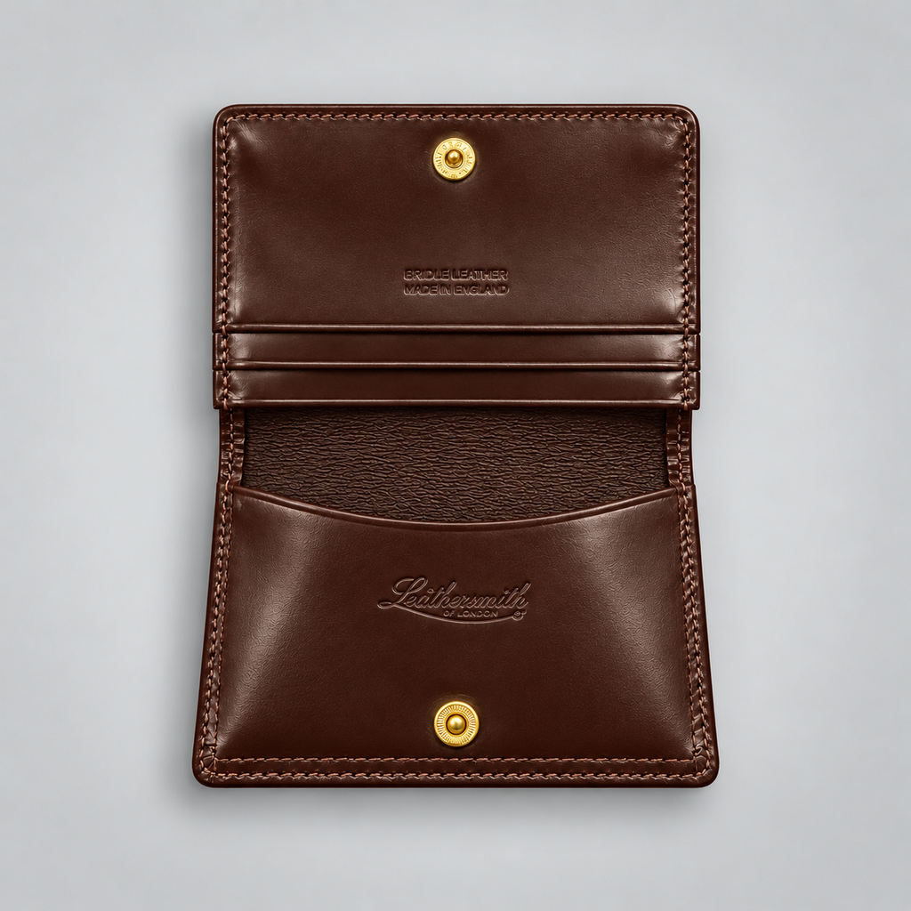 A dark brown leather card holder wallet shown open, featuring gold-tone snap buttons, a card slot, and the embossed brand name 'Lithosmith' on the front pocket, set against a light gray background.