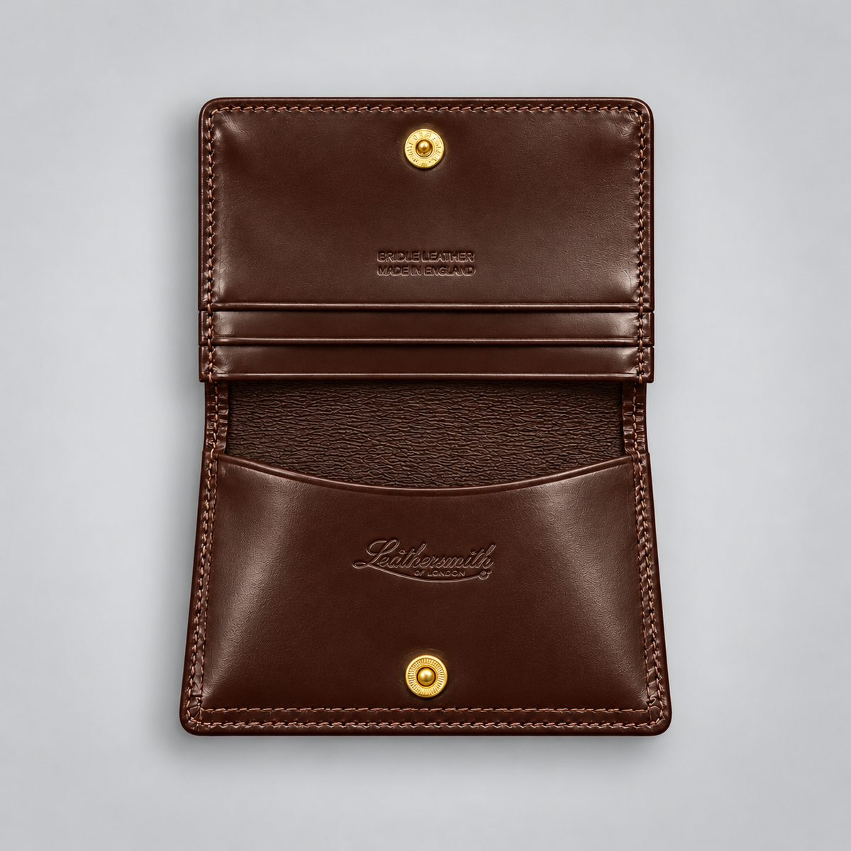 A dark brown leather card holder wallet shown open, featuring gold-tone snap buttons, a card slot, and the embossed brand name 'Lithosmith' on the front pocket, set against a light gray background.