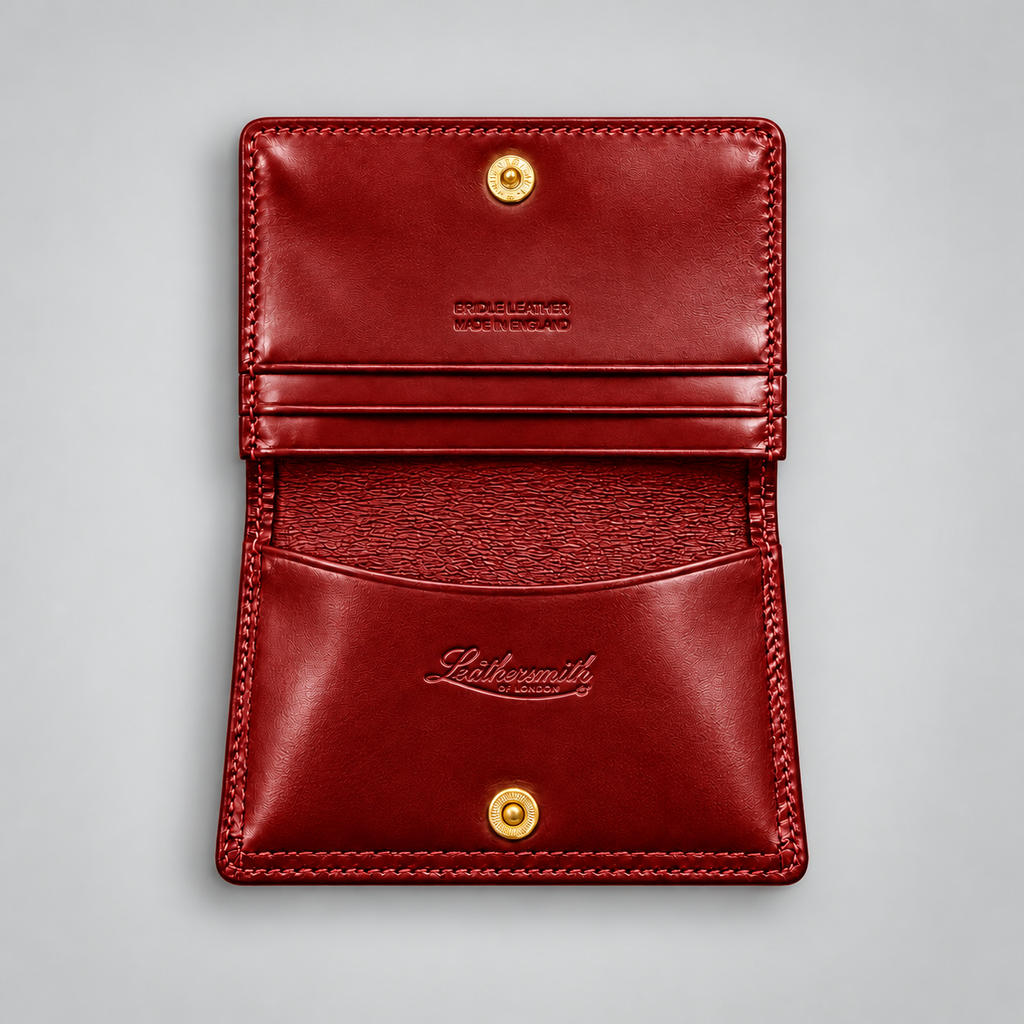 Red leather business card case showing gusseted compartments