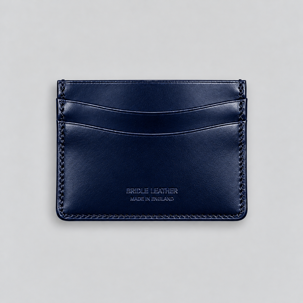 Reverse of navy bridle leather cardholder showing curved card slots
