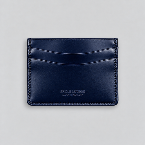 Reverse of navy bridle leather cardholder showing curved card slots